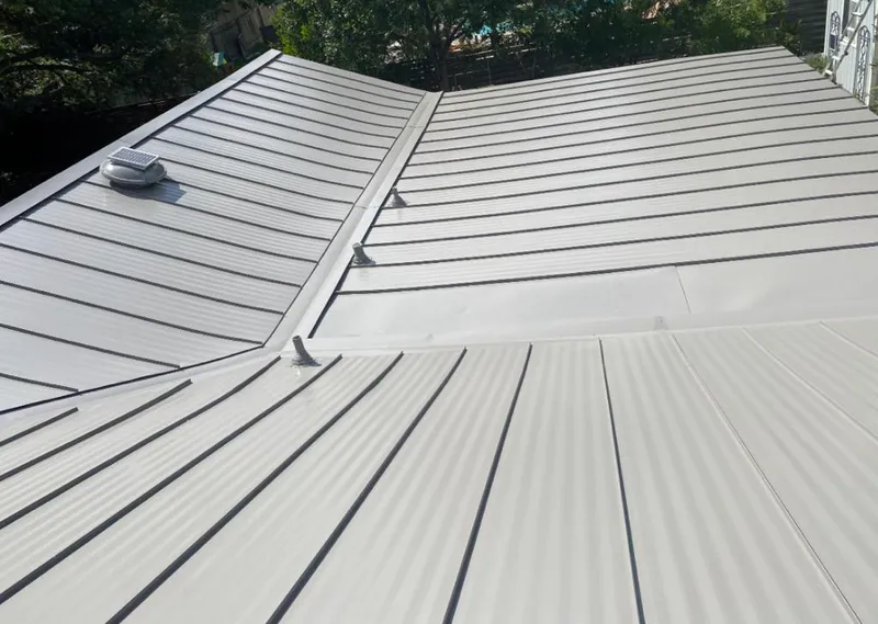 Solar attic fan installed on a metal roof for Roof Ventilation in Lackland AFB